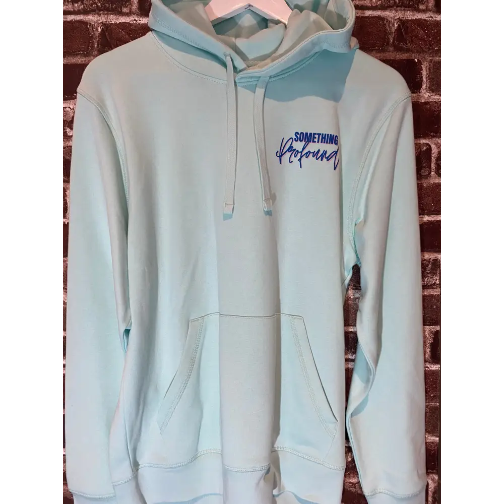 Caribbean blue hoodie with text on a brick wall background