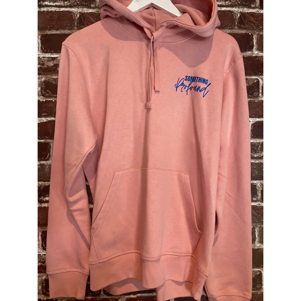 Pink hoodie with blue text on a textured surface