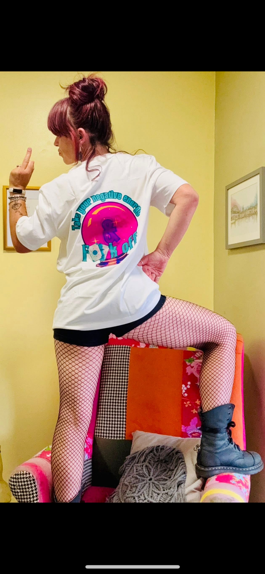 Kylie Dixon MBE wearing a Something Profound T-shirt with ‘take your negative energy and fuck off sticking her middle finger up