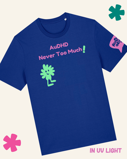 T-shirt with 'AuDHD Never Too Much!' text and a character on a blue background with glow-in-the-dark effect.