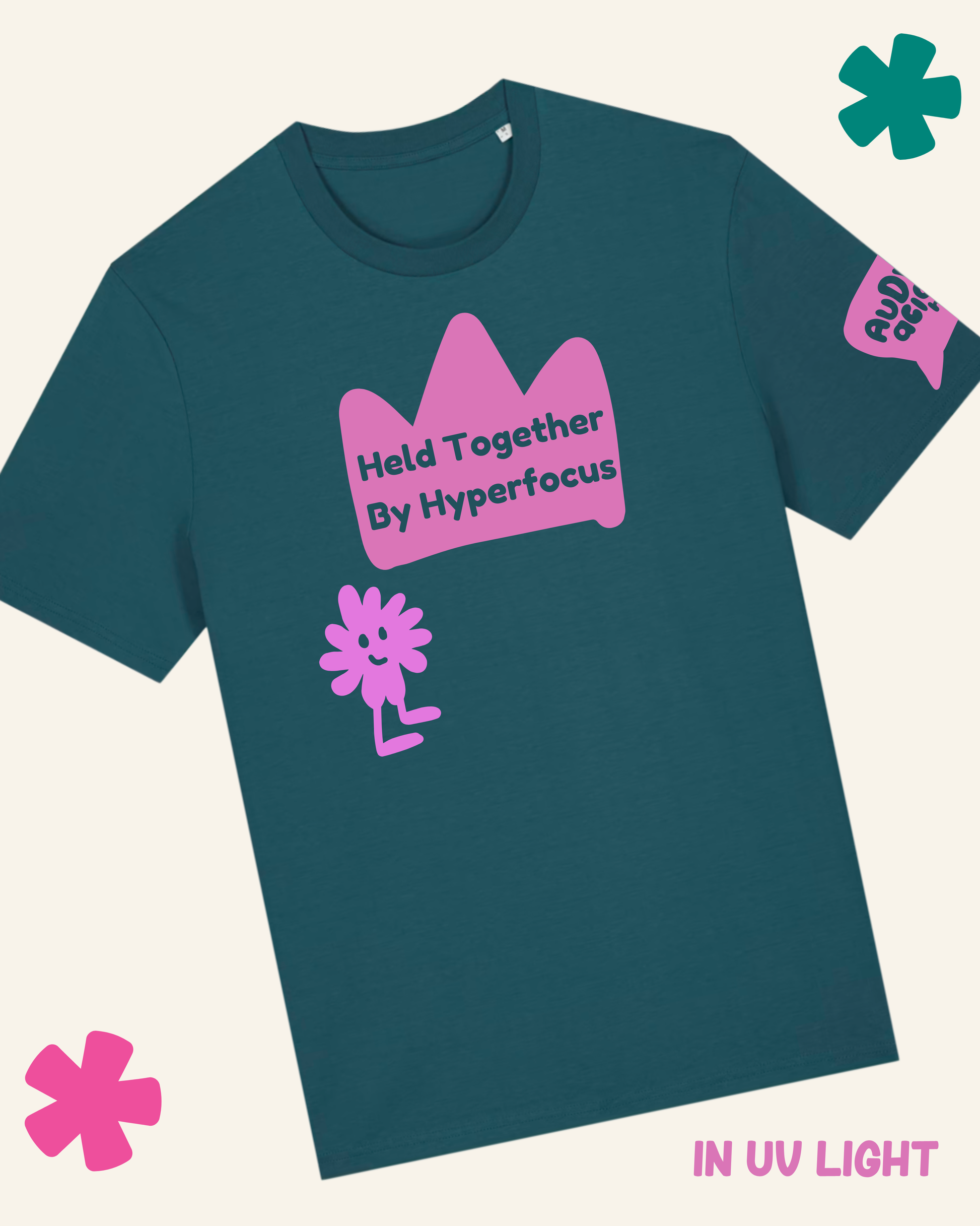 Teal t-shirt with pink graphics and text on a light gray background