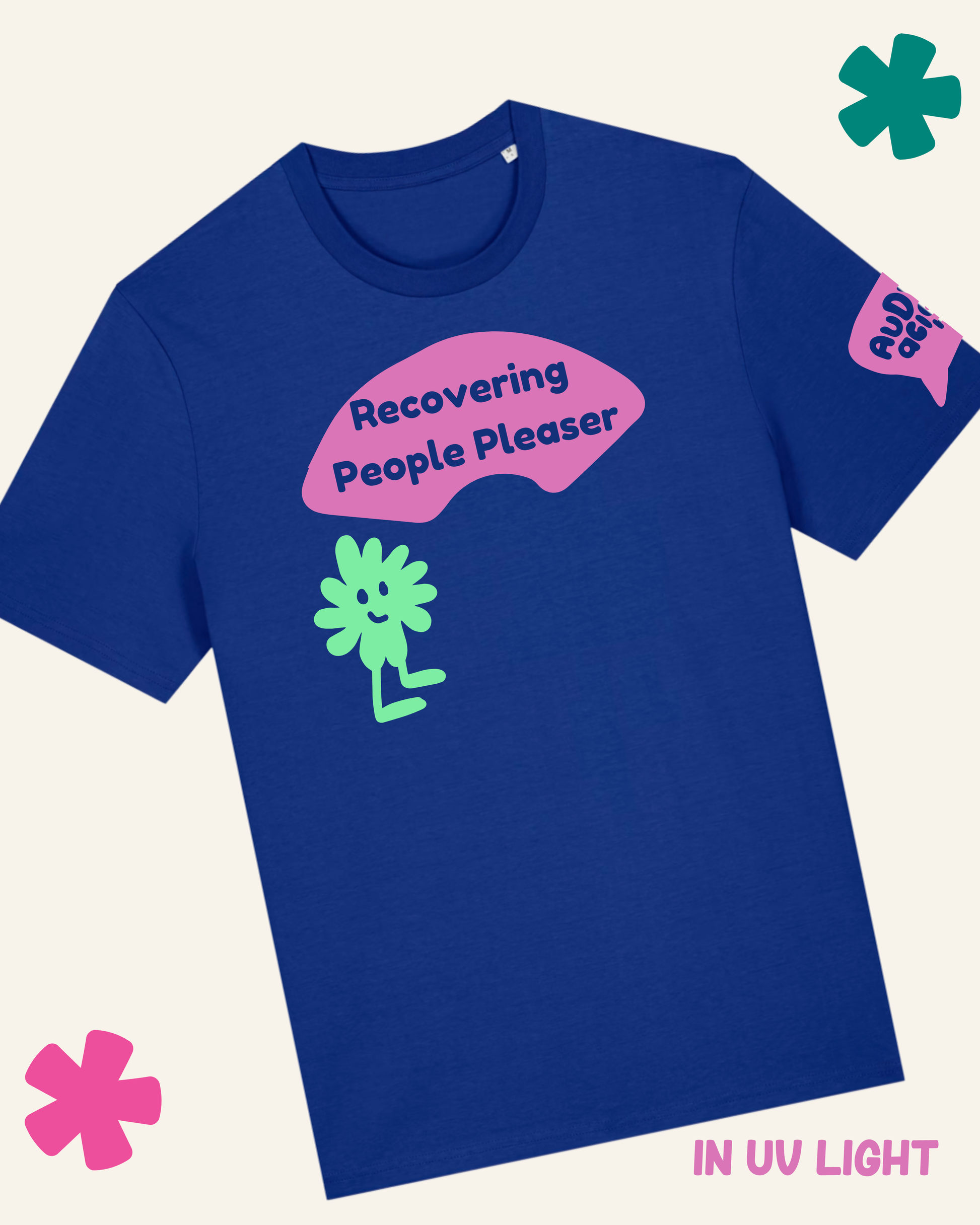 Blue t-shirt with pink and green graphic and text 'Recovering People Pleaser' on a light gray background.