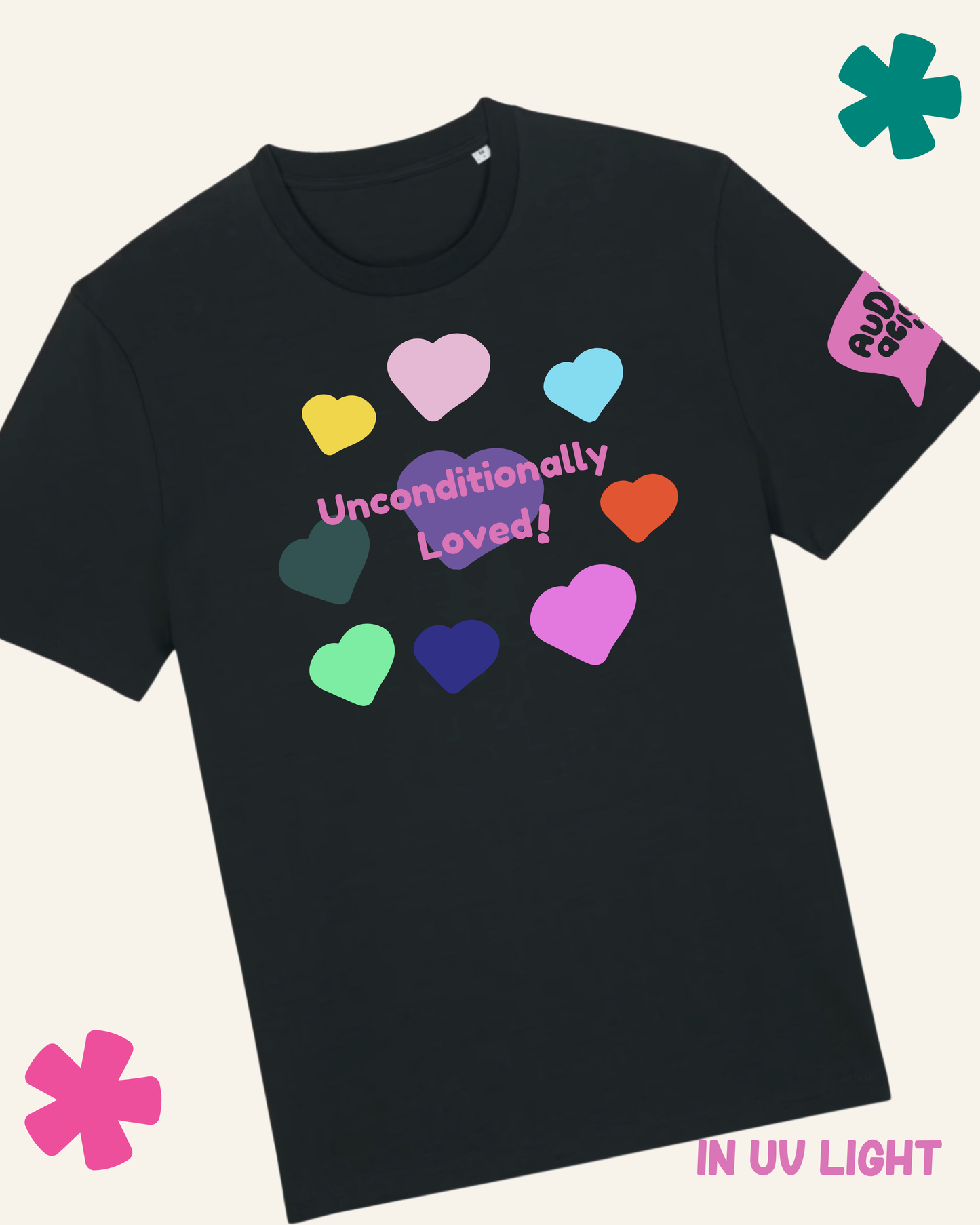 Black t-shirt with colorful hearts and 'Unconditionally Loved' text on a light gray background