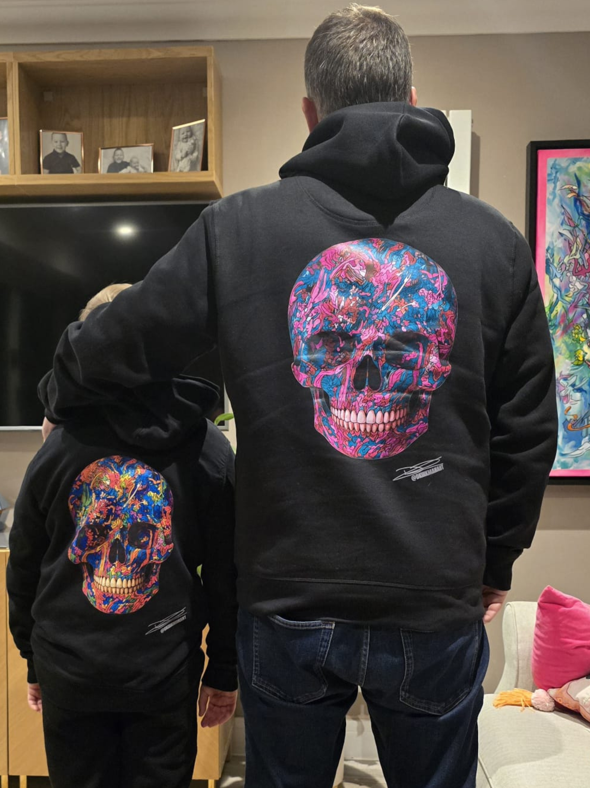 David Kirkman and his son wearing graffiti skull hoodies 