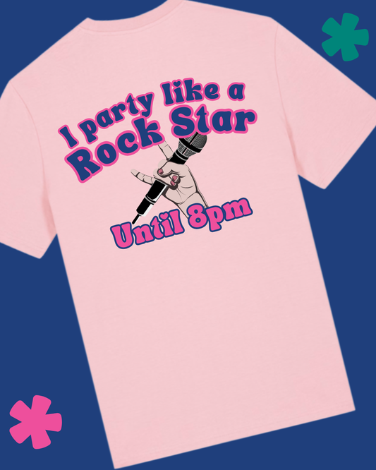 Pink t-shirt with 'I party like a rock star until 8pm' text and tattoo design on a blue background