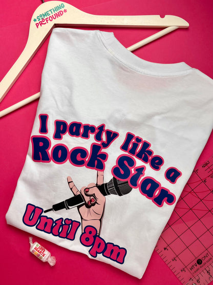 White t-shirt with 'I party like a rock star until 8pm' design on a pink background
