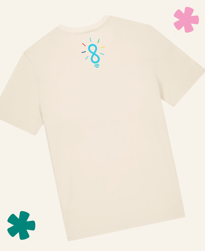 An off-white short-sleeve t-shirt shown from the back, featuring a small light blue lightbulb graphic with colorful lines near the upper back. The t-shirt is displayed on a matching off-white background with decorative pink and teal flower graphics in the corners.Unite Club x Something Profound