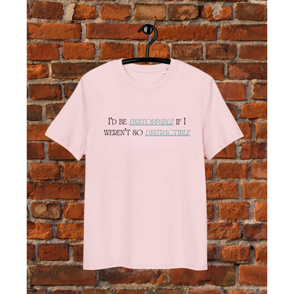 Pink t-shirt with text on a hanger against a brick wall d be unstoppable if i weren't so distractible pink