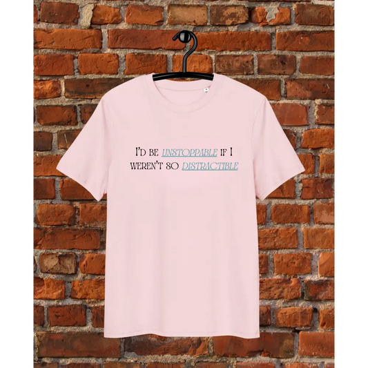 Pink t-shirt with text on a hanger against a brick wall d be unstoppable if i weren't so distractible pink