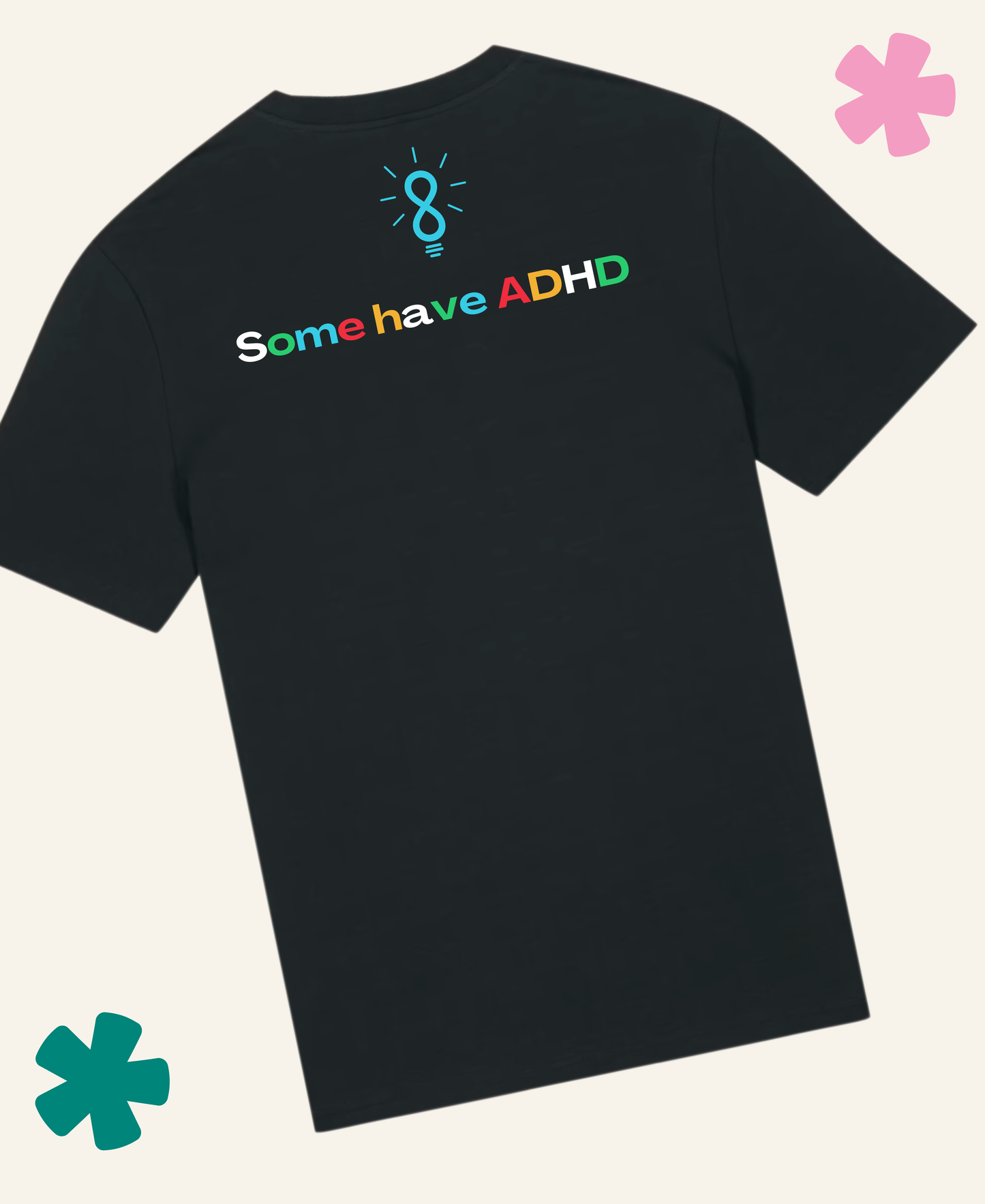 A black short-sleeve t-shirt shown from the back, featuring a colorful graphic that reads 'Some have ADHD' in multicolor lettering with a teal lightbulb icon above it. The t-shirt is displayed on a light cream background with decorative pink and teal flower graphics in the corners. Unite Club x Something Profound