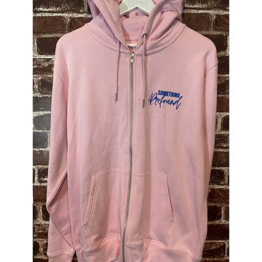 Pink zip hoodie with a logo on a brick wall