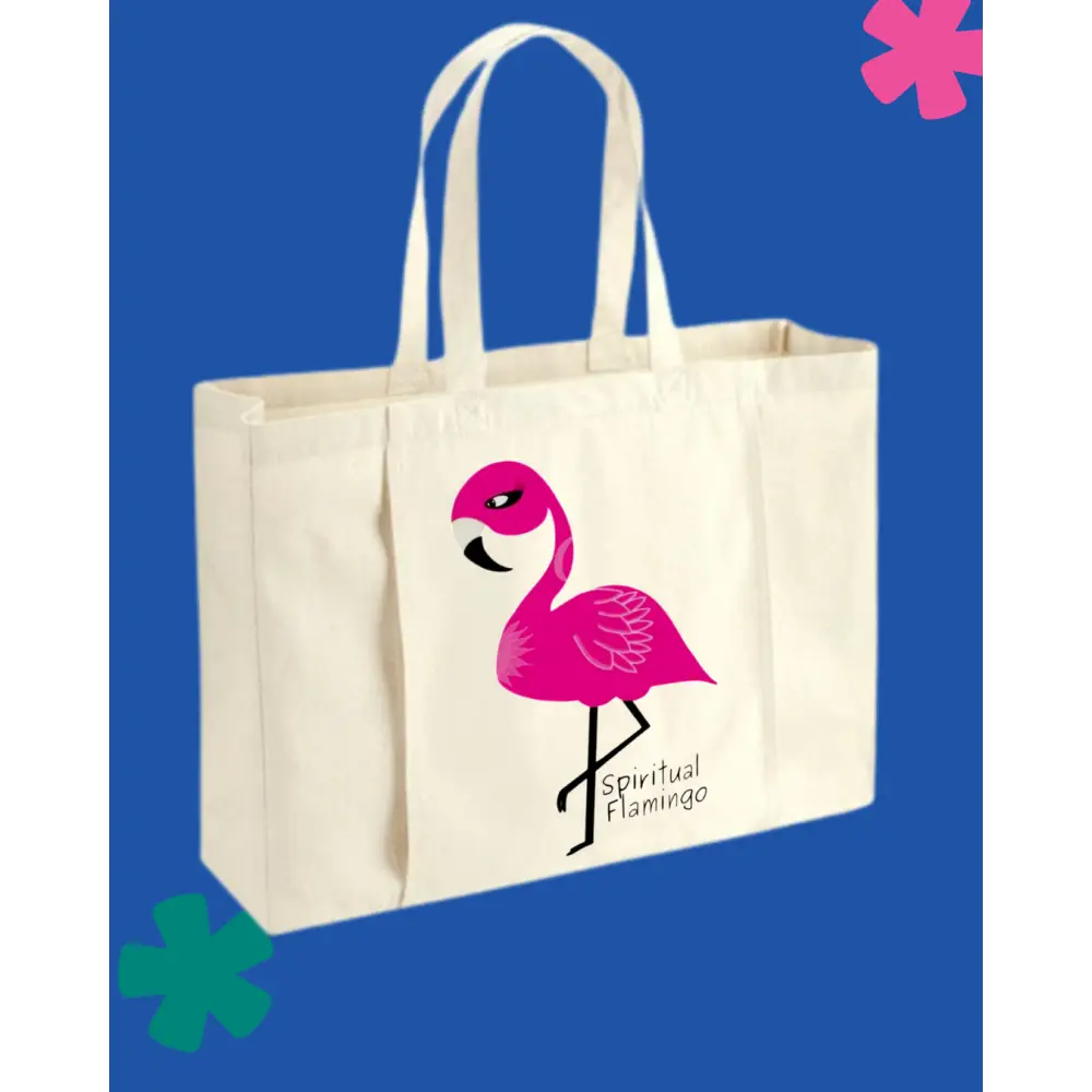 Beige tote bag with pink flamingo design and 'Spiritual Flamingo' text on a blue background