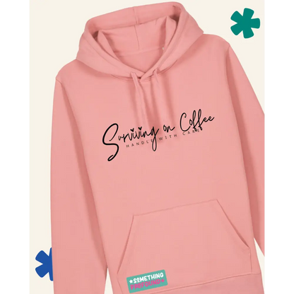 Pink hoodie with text on a light gray background