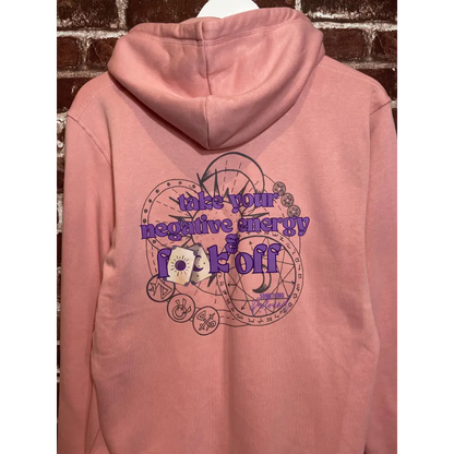 Pink hoodie with a graphic design and text on a textured surface take your negative energy and f**k off
