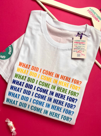 White t-shirt with colorful text on a pink background