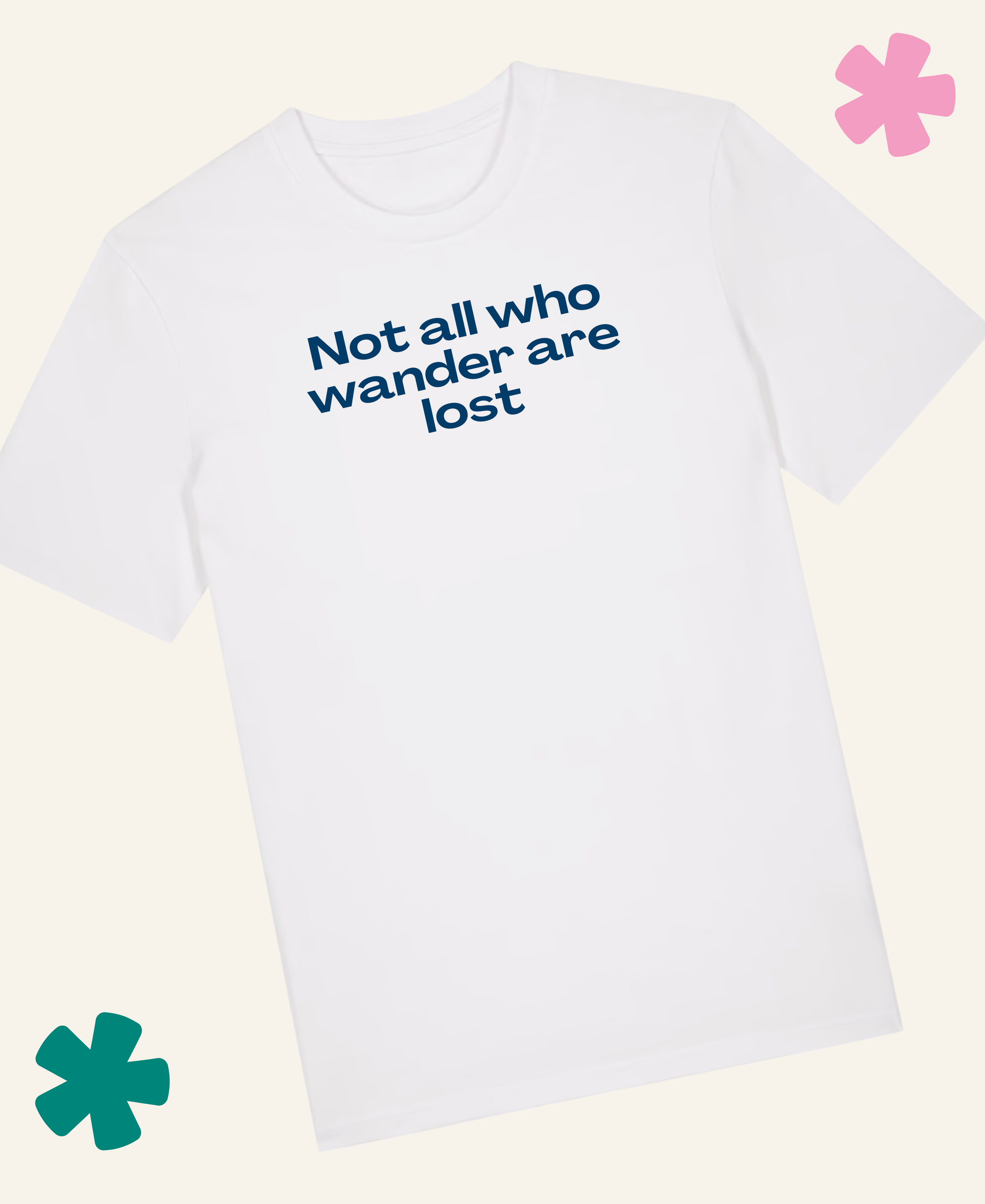 A white short-sleeve crewneck t-shirt with the phrase 'Not all who wander are lost' printed in blue text on the chest, displayed on a light cream background with decorative pink and teal flower graphics. Unite Club x Something Profound
